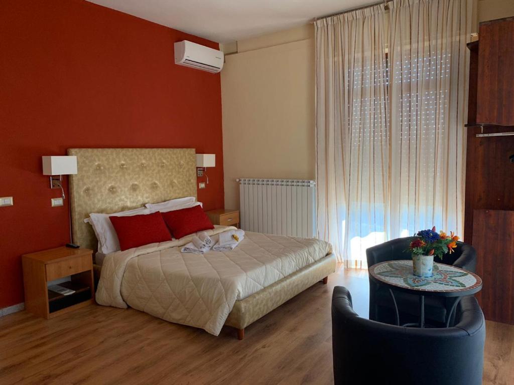 Postel nebo postele na pokoji v ubytování Sant'Oronzo B&B