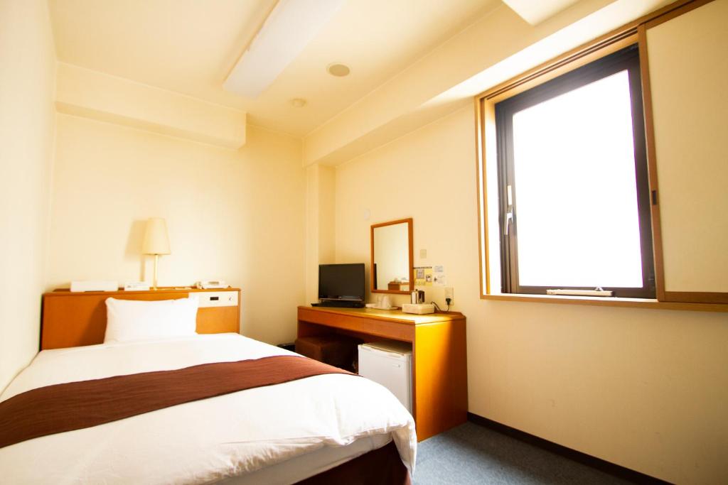 Postel nebo postele na pokoji v ubytování 3s HOTEL HIRATSUKA
