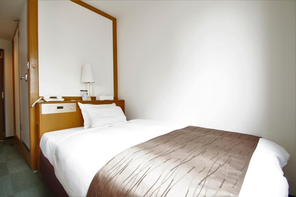 Postel nebo postele na pokoji v ubytování 3s HOTEL HIRATSUKA