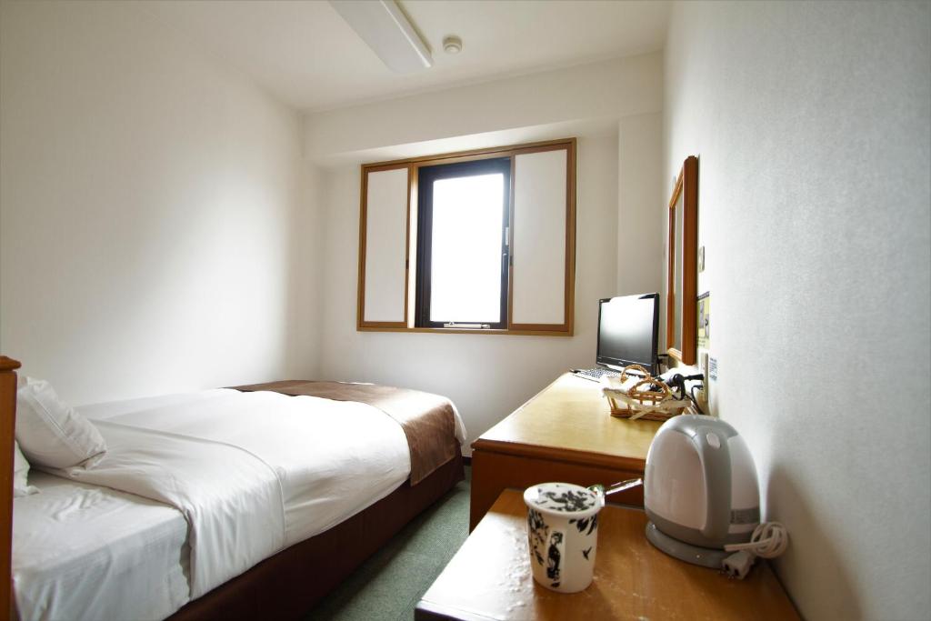 Postel nebo postele na pokoji v ubytování 3s HOTEL HIRATSUKA