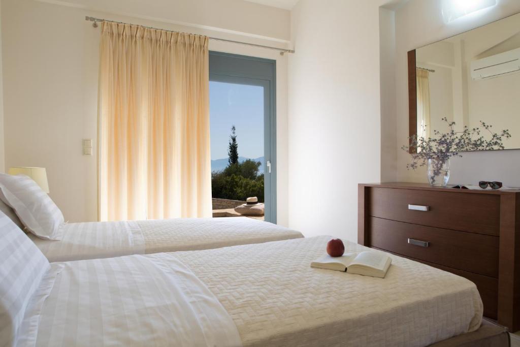 A bed or beds in a room at Nema Villa