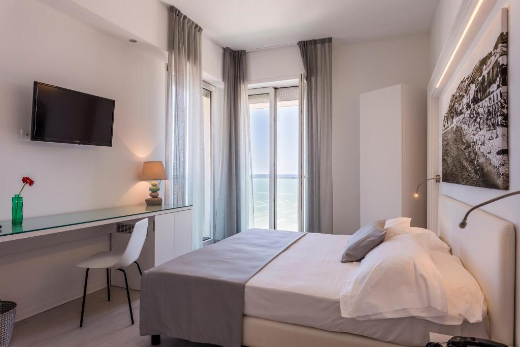 Postel nebo postele na pokoji v ubytování Hotel Nobel