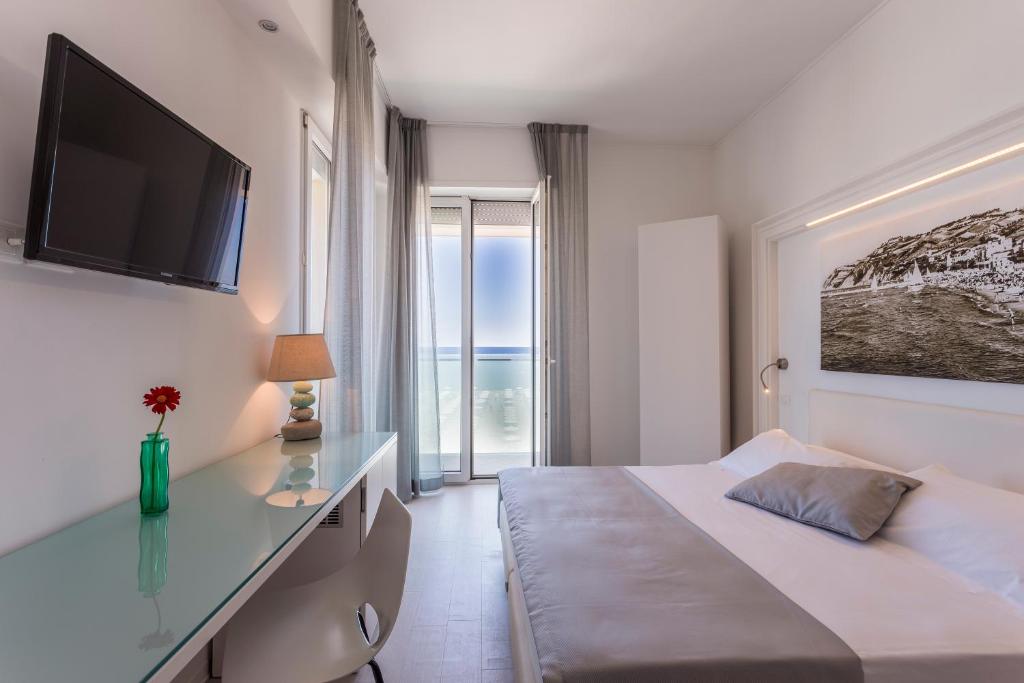 Postel nebo postele na pokoji v ubytování Hotel Nobel