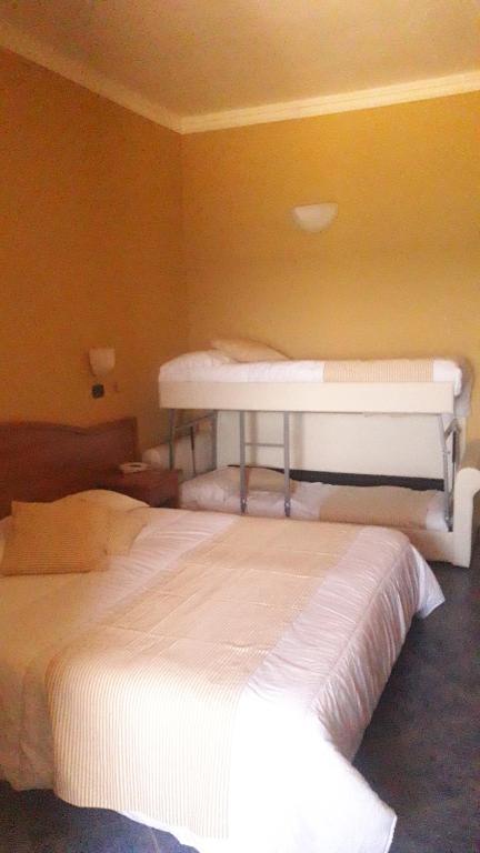 Postel nebo postele na pokoji v ubytování Hotel Beaurivage