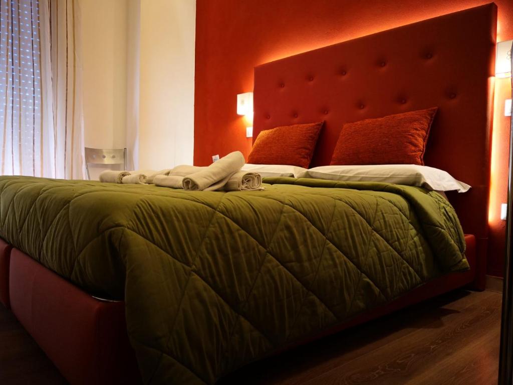Postel nebo postele na pokoji v ubytování Sant'Oronzo B&B
