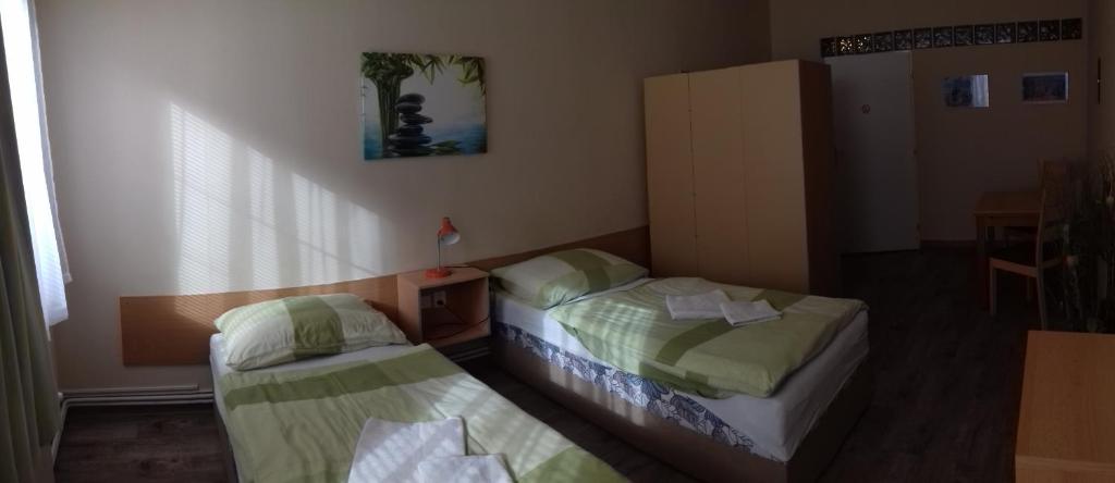 Postel nebo postele na pokoji v ubytování Apartmány Brno