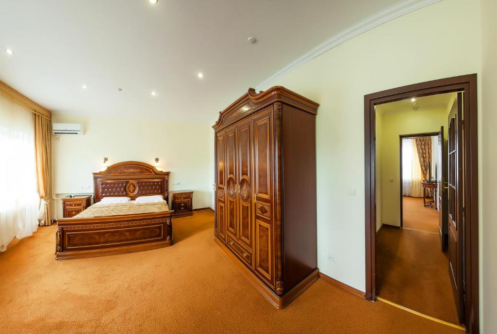 Postel nebo postele na pokoji v ubytování Resort Hotel Karpaty