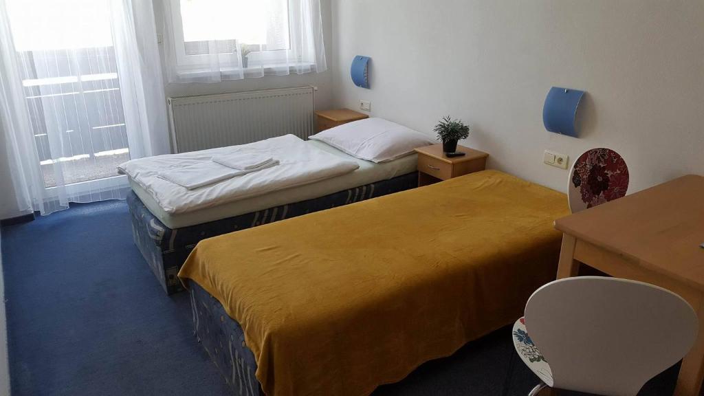 Postel nebo postele na pokoji v ubytování Chata Triomint