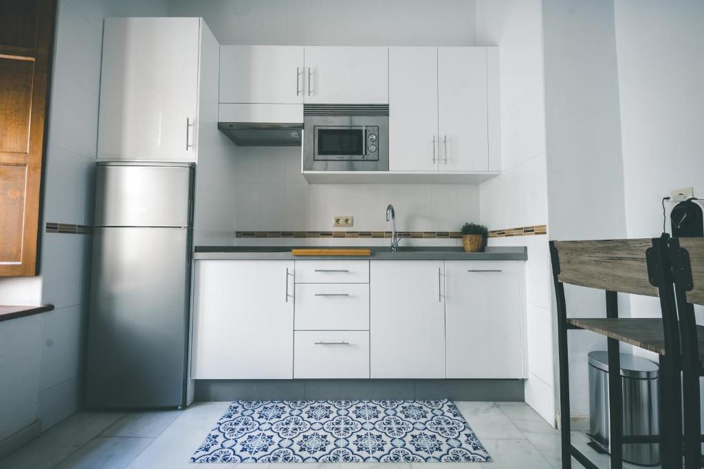 Kuchyň nebo kuchyňský kout v ubytování LUXURY & NEW APARTMENT CORREDERA