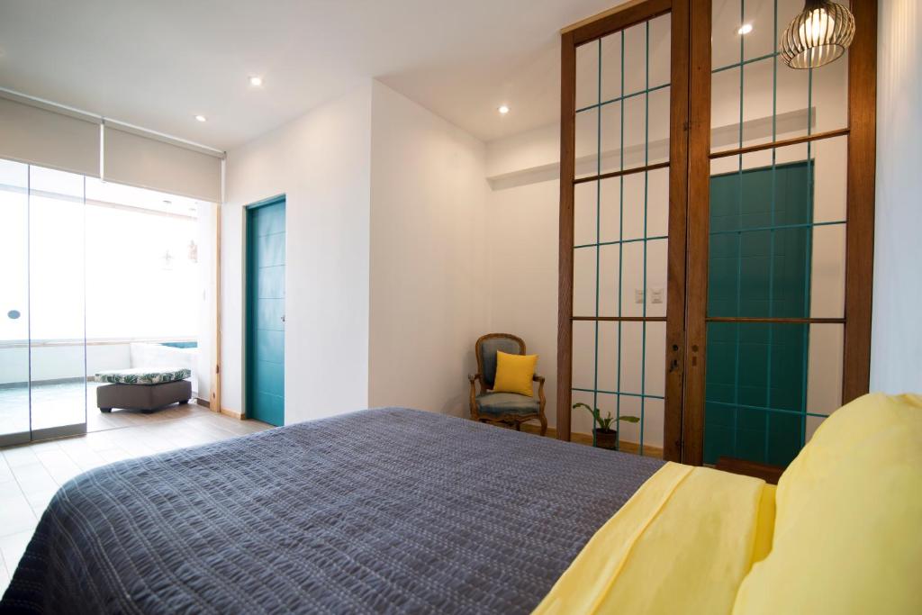 Postel nebo postele na pokoji v ubytování Kauhuhu Casa Hotel
