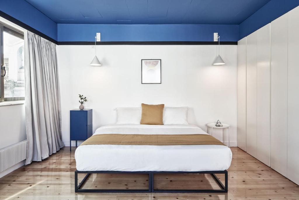 Posteľ alebo postele v izbe v ubytovaní MONO Lofts