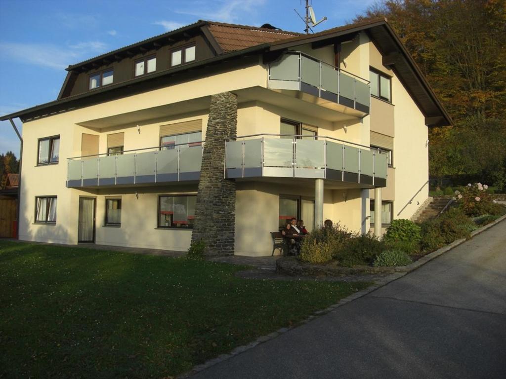 a large house with a balcony on the side of it at Ferienwohnung Seidl in Waffenbrunn