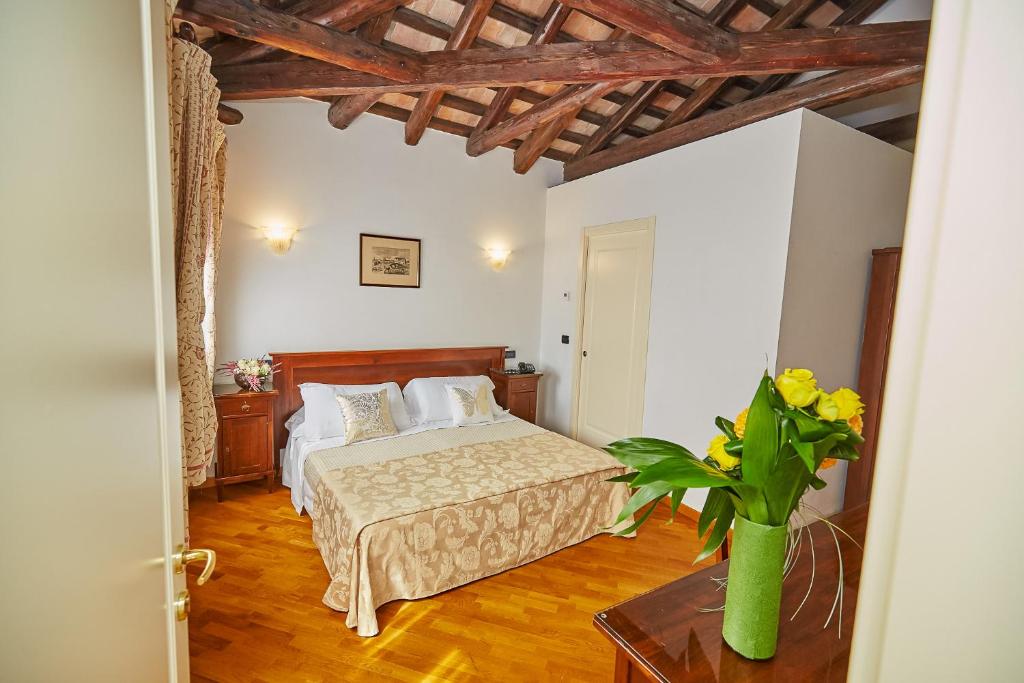Postel nebo postele na pokoji v ubytování Hotel Riviera dei Dogi