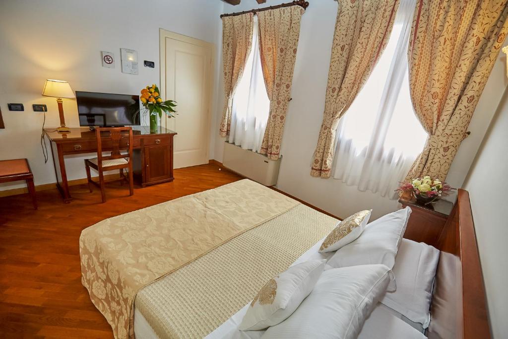 Postel nebo postele na pokoji v ubytování Hotel Riviera dei Dogi