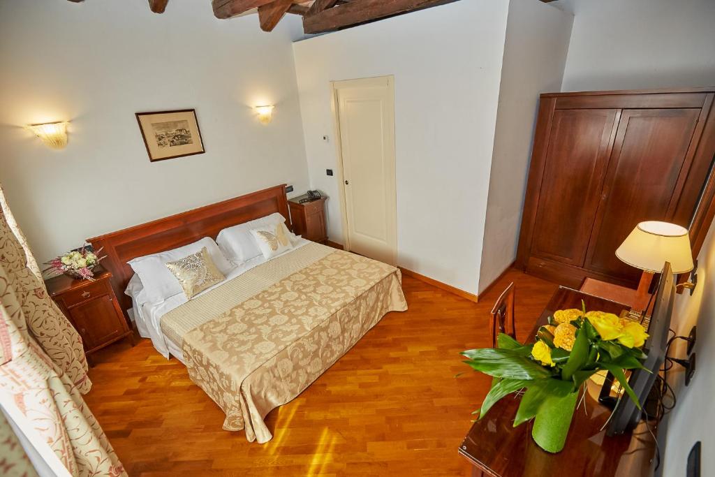 Postel nebo postele na pokoji v ubytování Hotel Riviera dei Dogi