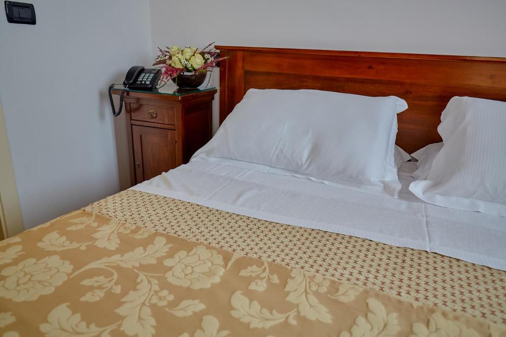 Postel nebo postele na pokoji v ubytování Hotel Riviera dei Dogi
