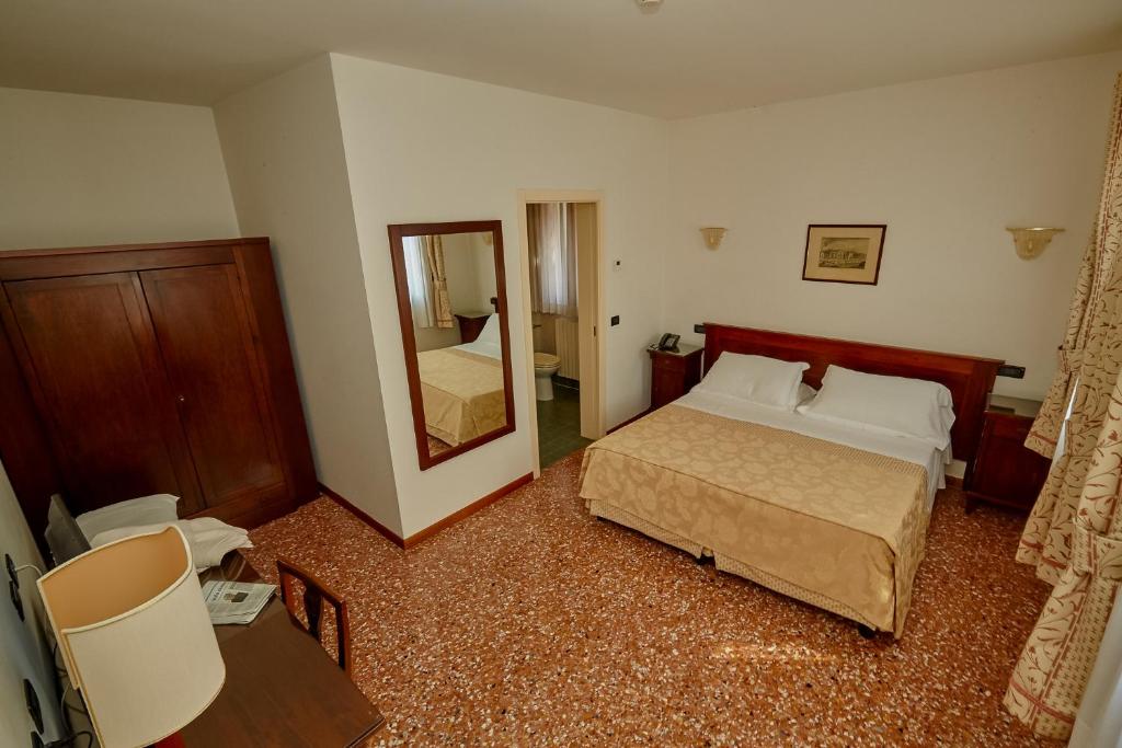 Postel nebo postele na pokoji v ubytování Hotel Riviera dei Dogi