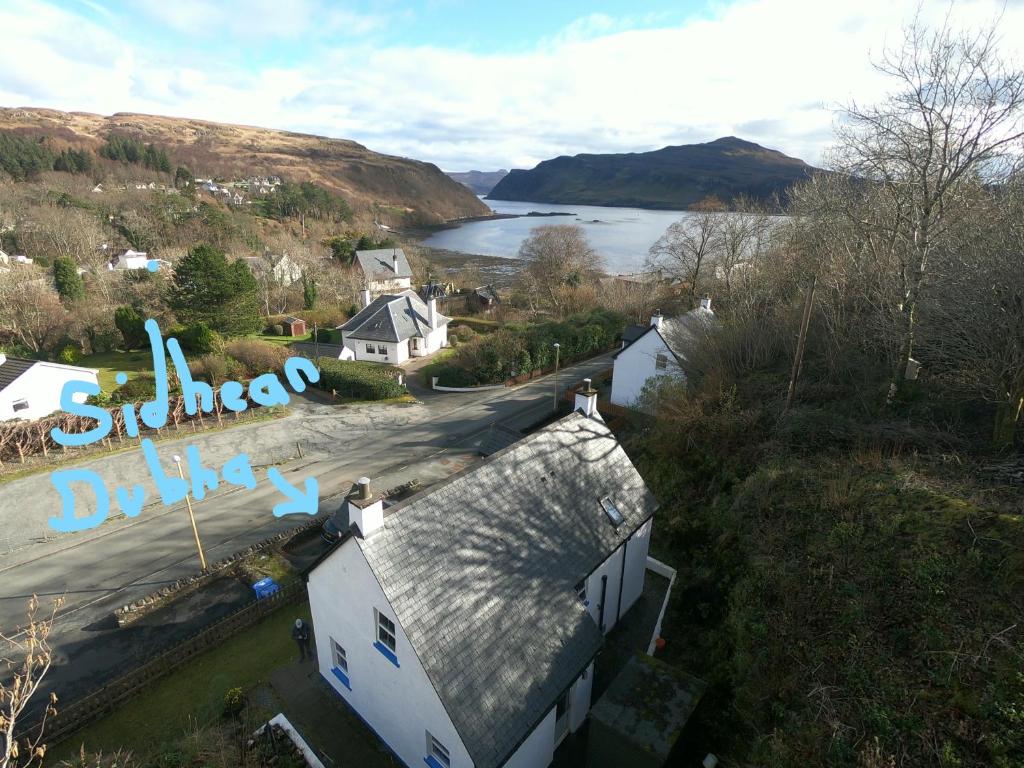 an aerial view of a house and a lake at Sidhean Dubha Holiday Home in Portree