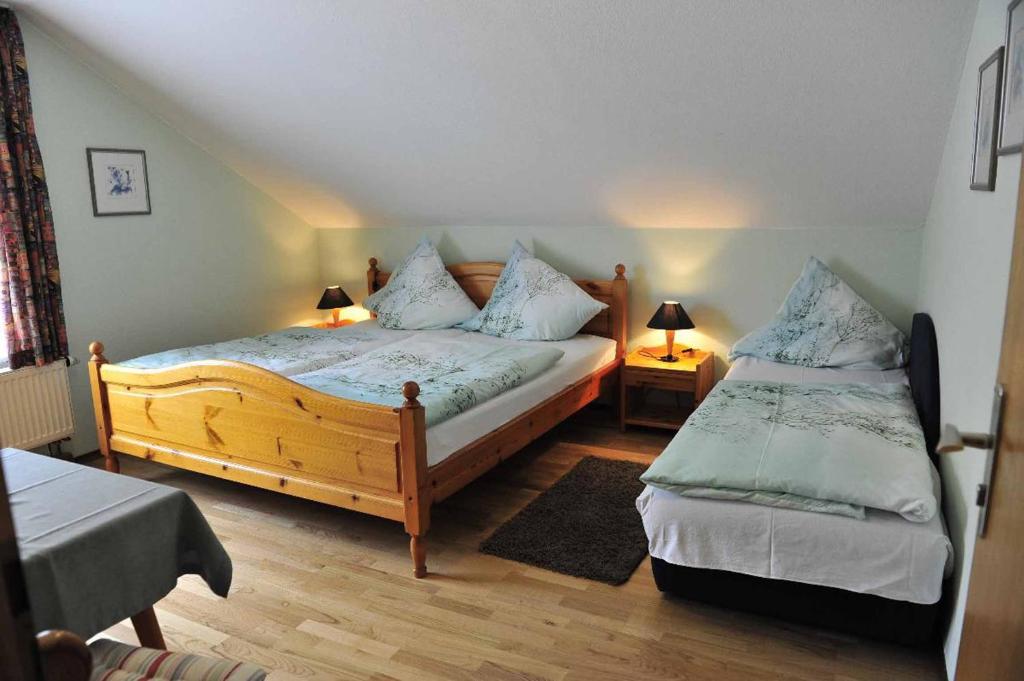 Postel nebo postele na pokoji v ubytování Pension Holzapfel