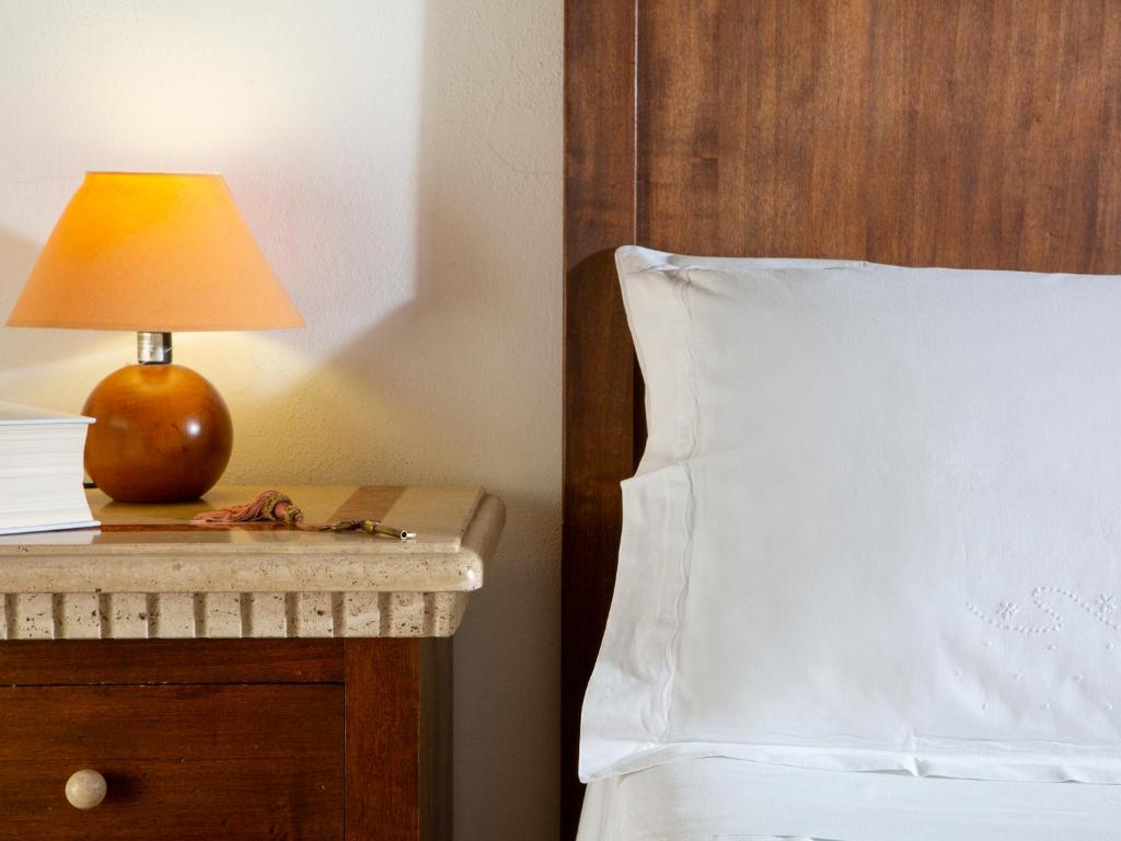 Postel nebo postele na pokoji v ubytování Al Guado di Assisi B&B