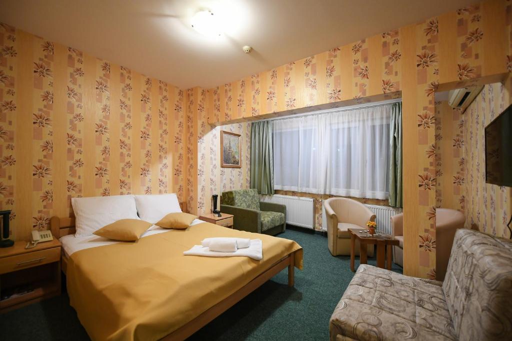 Postel nebo postele na pokoji v ubytování Hotel Slodes