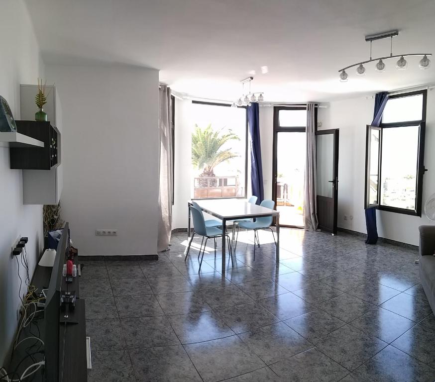 A television and/or entertainment centre at Central Seaview Apartment Puerto del Carmen