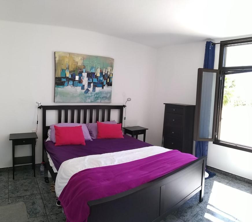 A bed or beds in a room at Central Seaview Apartment Puerto del Carmen