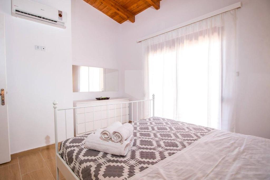 Postel nebo postele na pokoji v ubytování Emerald Dream Apartment