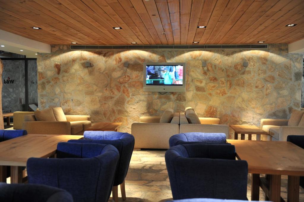 TV a/nebo společenská místnost v ubytování Bianca Resort & Spa