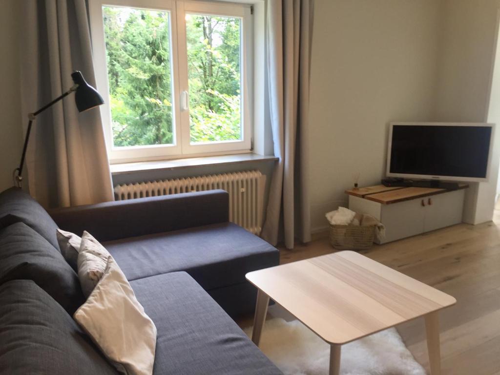 a living room with a couch and a table at Ferienwohnung Börner ll in Kniebis