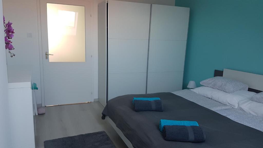 Postel nebo postele na pokoji v ubytování Promenad Apartman