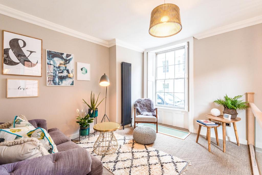 a living room with a couch and a table at King Street Apartment in Norwich