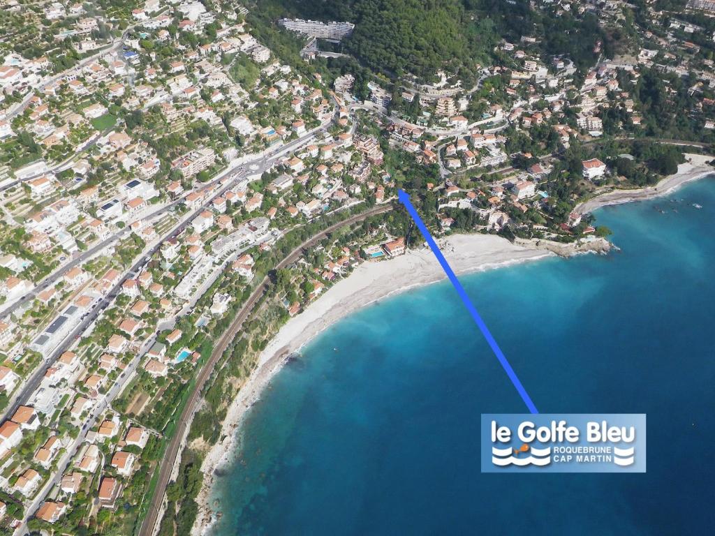 an aerial view of a beach next to the ocean at Résidence &quot;Le Golfe Bleu&quot; in Roquebrune-Cap-Martin