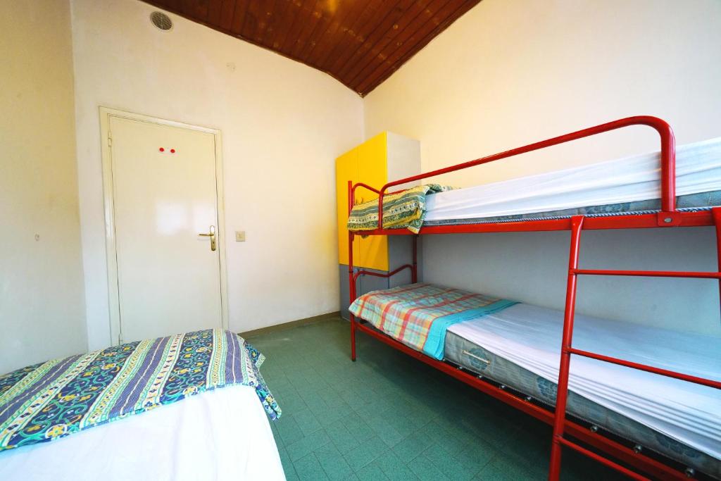 Postel nebo postele na pokoji v ubytování Villetta 2C
