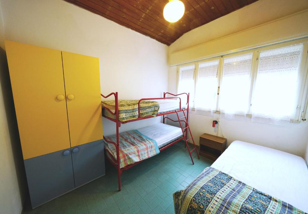 Postel nebo postele na pokoji v ubytování Villetta 2C