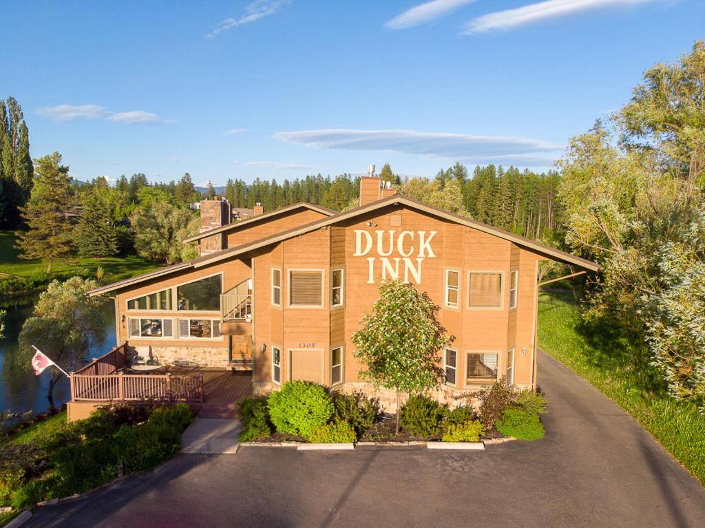 a house with a sign that reads duck inn at Duck Inn Lodge in Whitefish