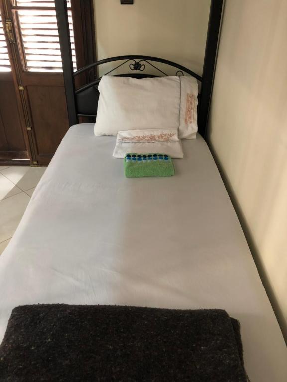 Una cama o camas en una habitación de TanjaLucia Hostel
