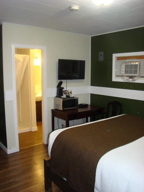 Postel nebo postele na pokoji v ubytování Paddock Inn