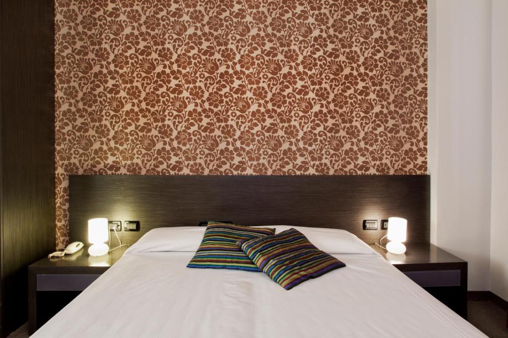 Postel nebo postele na pokoji v ubytování MA Hotel