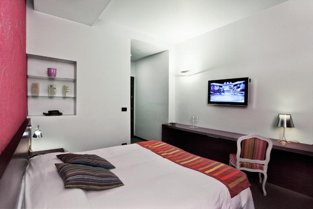 Postel nebo postele na pokoji v ubytování MA Hotel
