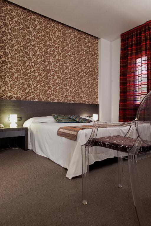 Postel nebo postele na pokoji v ubytování MA Hotel