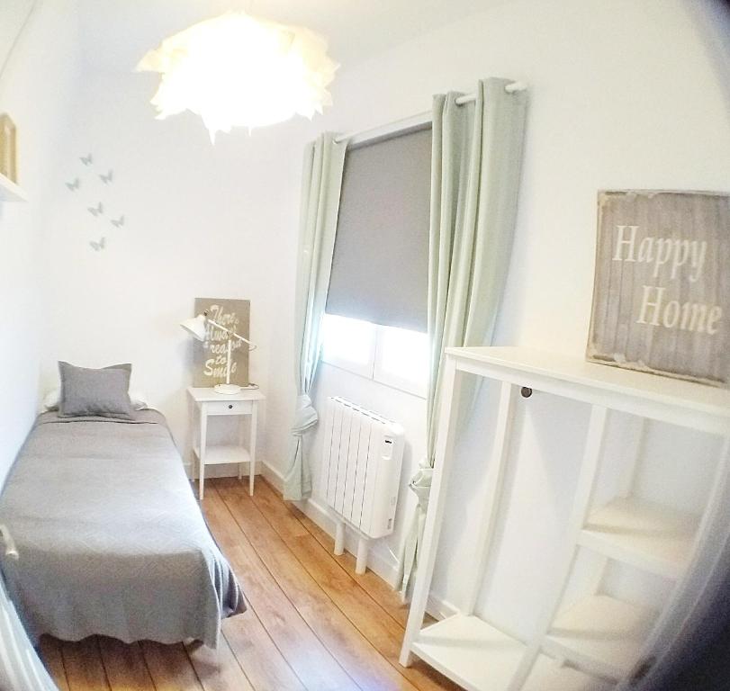 Postel nebo postele na pokoji v ubytování Hotel Smile & Co Hostal Boutique