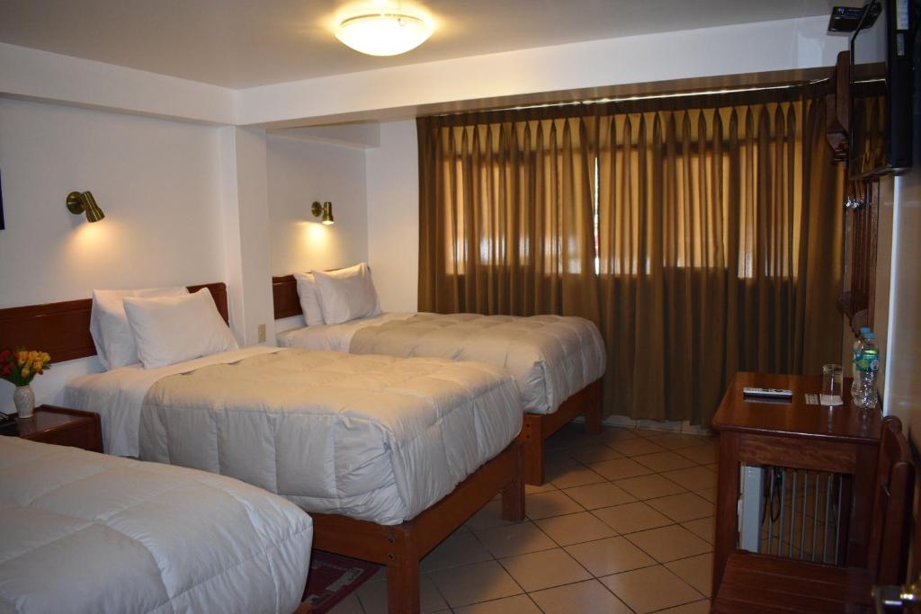 Postel nebo postele na pokoji v ubytování Casa De Luz Hotel