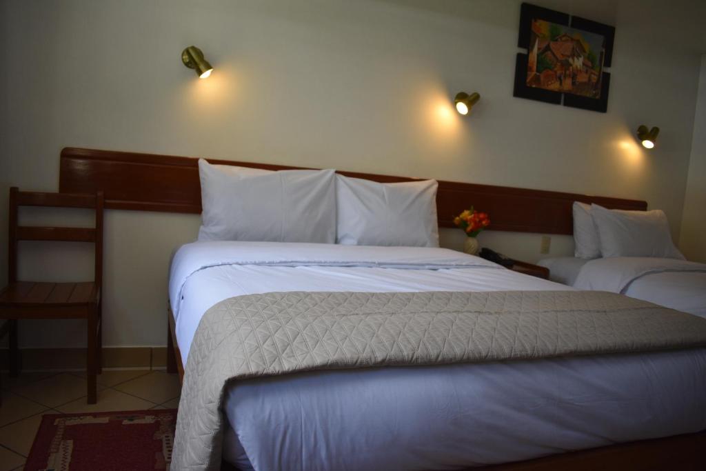Postel nebo postele na pokoji v ubytování Casa De Luz Hotel