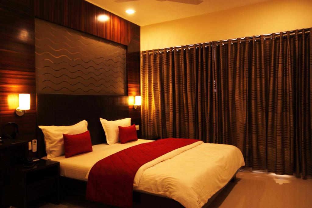 Postel nebo postele na pokoji v ubytování Hotel Furaat Inn