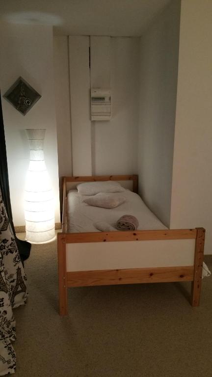 Postel nebo postele na pokoji v ubytování Chambres touristiques La Cour Des Hôtes