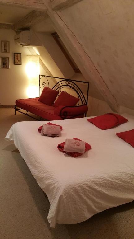 Postel nebo postele na pokoji v ubytování Chambres touristiques La Cour Des Hôtes