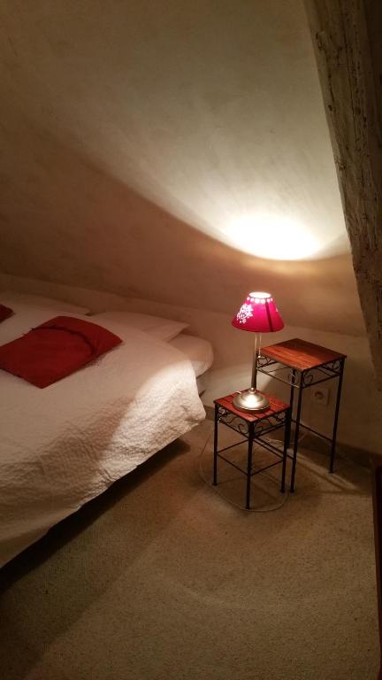 Postel nebo postele na pokoji v ubytování Chambres touristiques La Cour Des Hôtes