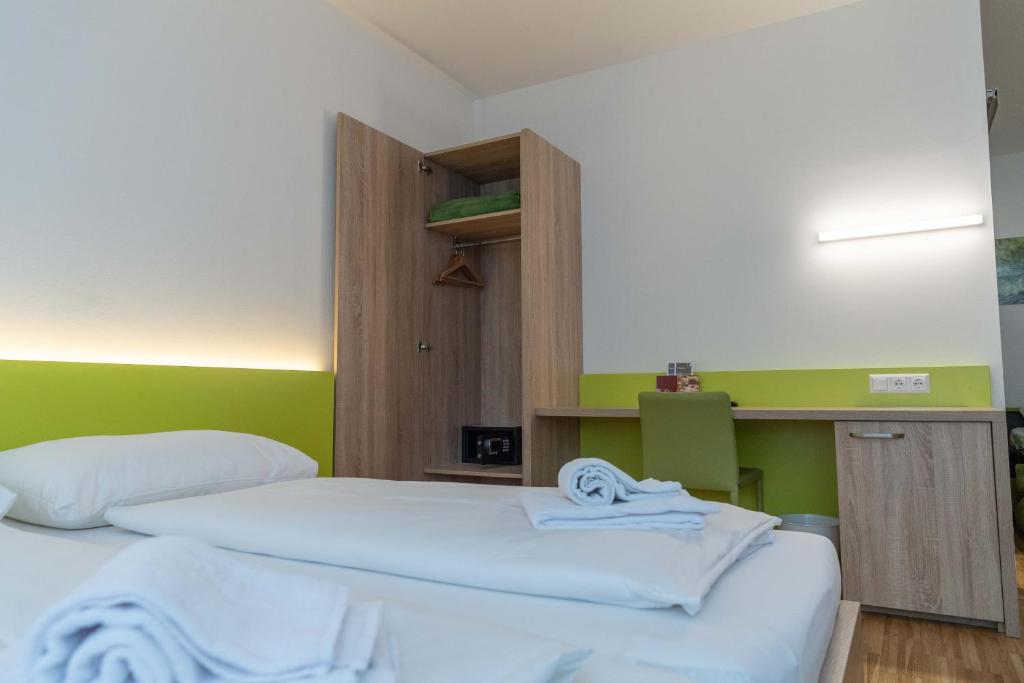Postel nebo postele na pokoji v ubytování Hotel Restaurant Meyer
