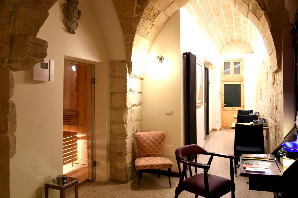 a room with a desk and a chair in a building at La Monaca Salentina in Lecce